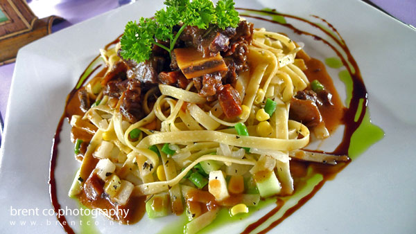 Braised beef ribs topped on pasta Braised beef ribs topped on pasta